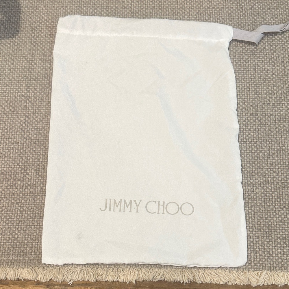 Jimmy Choo embroidered white dust bag.